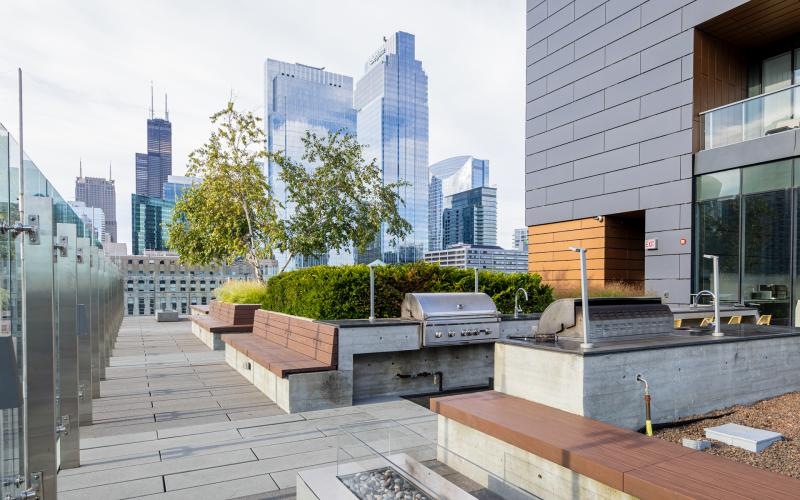 a grilling deck with a skyline