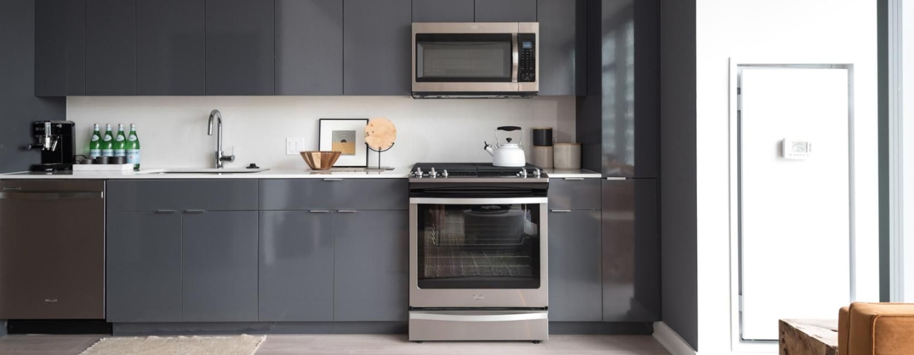 a kitchen with black cabinets